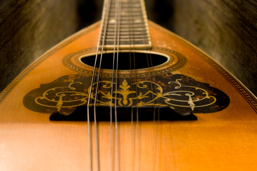 Closeup shot of an antique mandolin (string instrument).  Shot with a shallow depth of field.