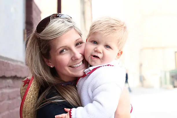 Photo of Smiling young Mom with Baby