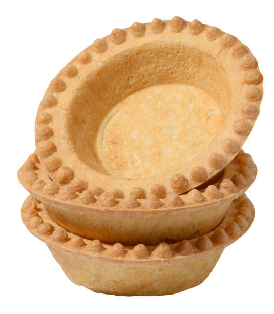istock Stack of empty baked round canape baskets isolated on white background, close up 1828420878