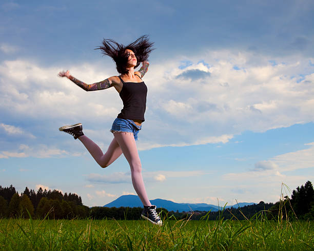 istock Young girl jumping 182842138
