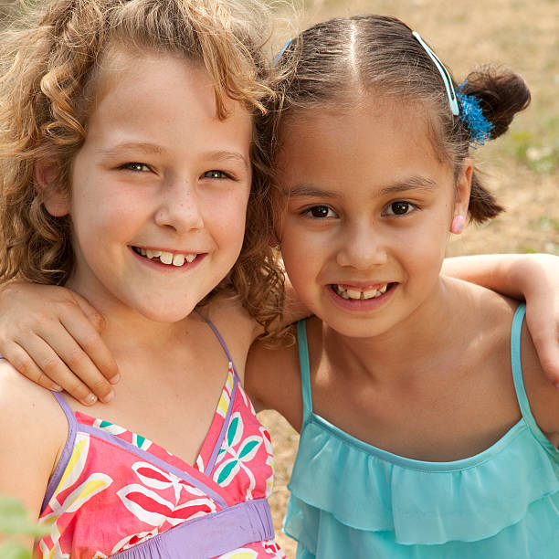 istock two girls being friends 182842221