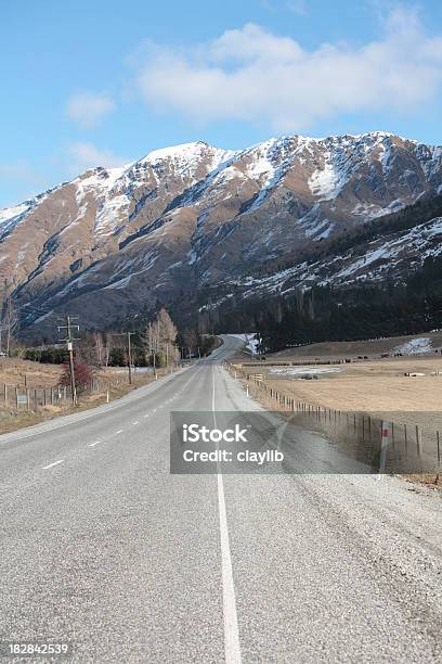 Road And Snow Covered Range Stock Photo - Download Image Now - Asphalt, Beauty In Nature, Color Image