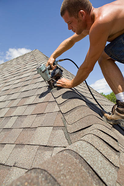istock Roofer Using Air Nailer to Fasten Shingle 182842590