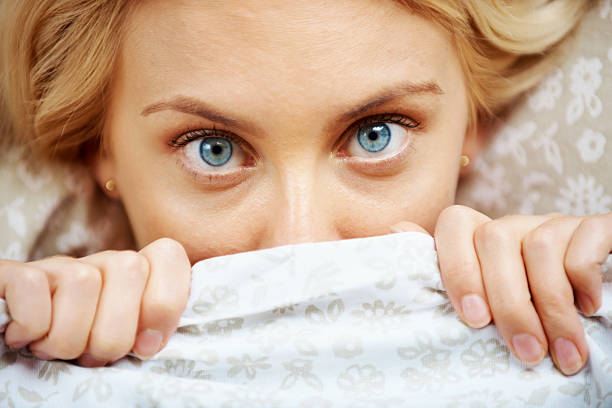istock Woman lying in bed doesn't want to wake up 182842603