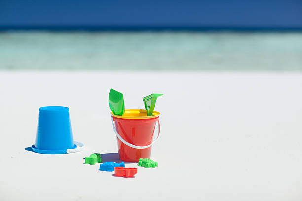 istock sand toys on beach 182842889