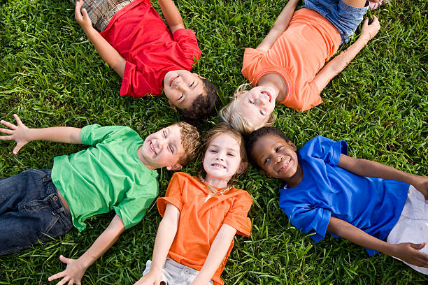 istock Diverse group of children representing unity, friendship, teamwork and community 182842976