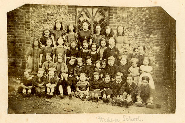 Hedsor School Photograph Vintage photograph taken circa 1870 of a group of school children and their teacher. elementary school building photos stock pictures, royalty-free photos & images