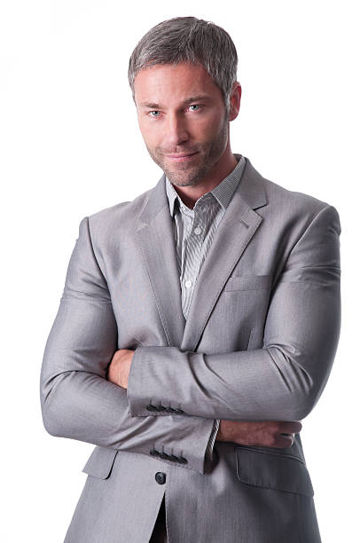 istock smiling businessman with arms crossed 182843893