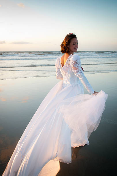 istock Beautiful Caucasian Bride on Cocoa Beach in Morning Light 182843960