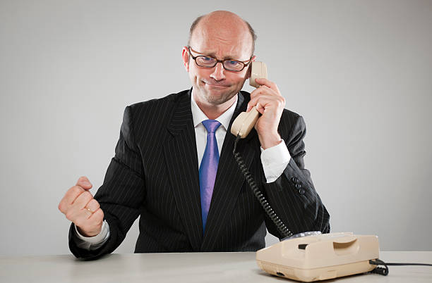 istock Businessman with old telephone 182844229