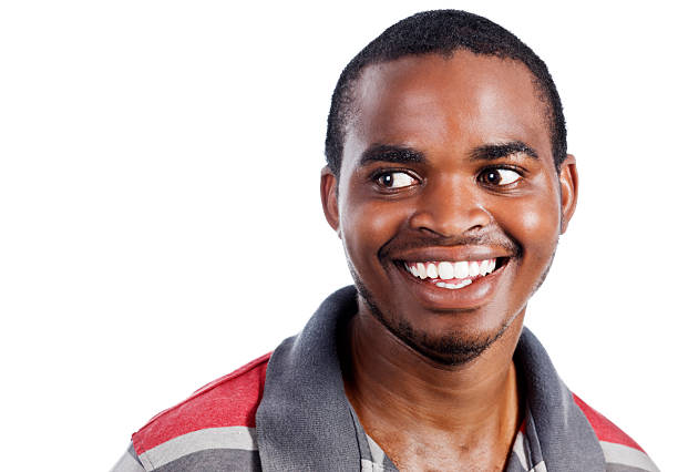 istock Smiling young African man looks to one side 182844234