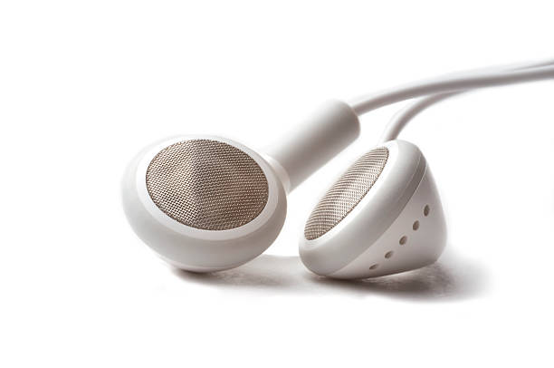 Headphones on a white background Close up photo of white headphones on a white background. headphones plugged in photos stock pictures, royalty-free photos & images