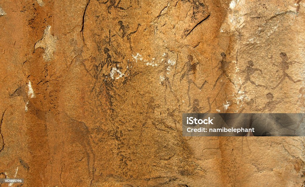 bushmen rock painting very old namibian rock paintig showing bushmen hunting a giraffe Hunter Stock Photo