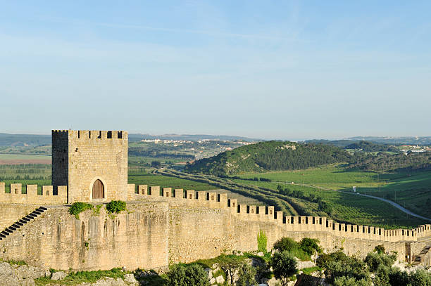 Fortified wall surrounding the medieval town of Óbidos,Portugal. Ancient fortifying wall surrounding the medieval town of Abidos, Portugal. obidos photos stock pictures, royalty-free photos & images