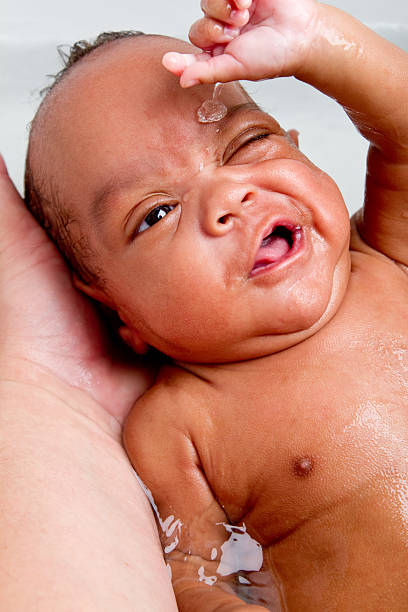 istock Cute Baby Boy Bathing in Kitchen Sink 182846082