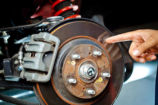 istock mechanic pointing at brake rotor 182846206