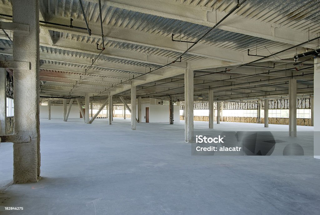 Unfinished office space "Large office building interior, never finished." Concrete Stock Photo