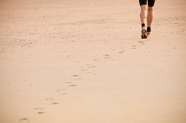 istock Lonely runner at the beach, early morning workout 182846357