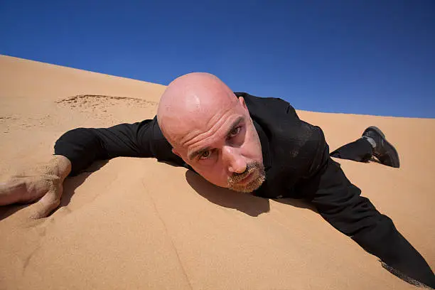 looser - businessman in sand