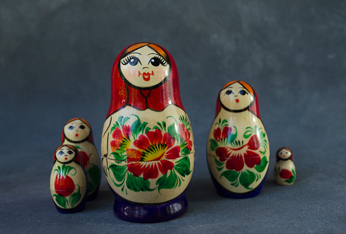 mother of a Russian family mamushka. matroishka dolls the whole family together on taupe background