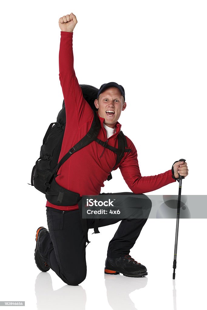 Isolated hiker backpacker celebrating on one knee Isolated hiker backpacker celebrating on one kneehttp://www.twodozendesign.info/i/1.png 20-29 Years Stock Photo