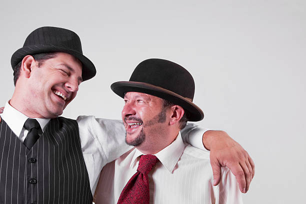 istock Two Men Wearing Hats Having a Laugh 182846673