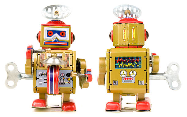 istock Wind up vintage toy robot on a white background 182847259
