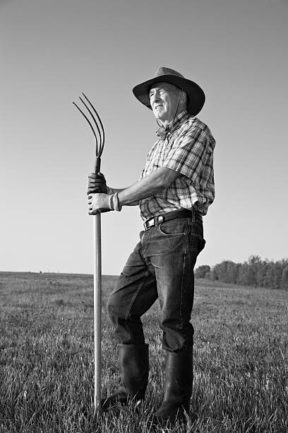 Farmer with pitchfork full length black and white