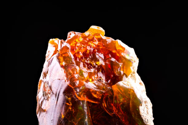 istock fire opal play-of-color isolated on black background 1828476630