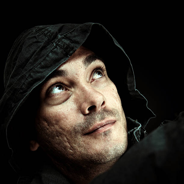 Hooded Latino Man looking up