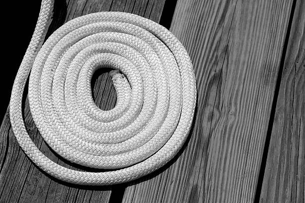 Rope rolled on pier stock photo