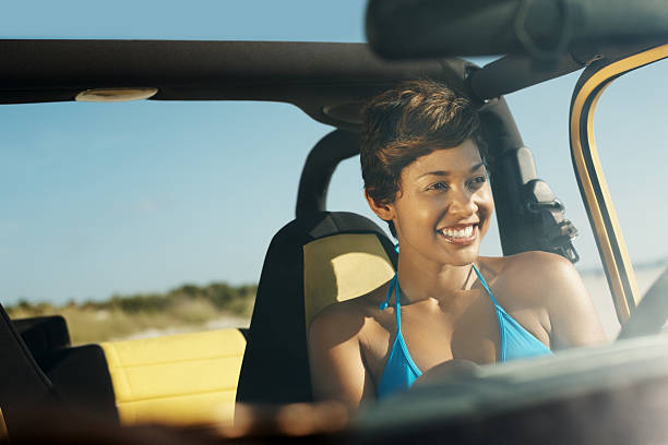 istock Smiling thoughtful woman at driver's seat 182848415