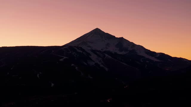 A stationary dramatic shot of Lone Mountain in Big Sky Montana