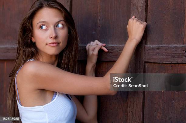 Girl Knocking Wooden Door Stock Photo - Download Image Now - Door, Knocking, Teenage Girls