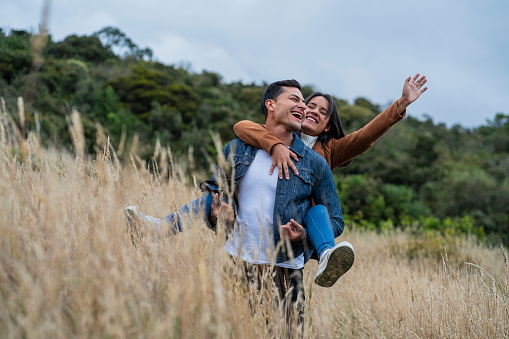 Special moment of peace and disconnection for a couple between 30 and 39 years old, spending a nice weekend as a couple with a lot of love in some cabins on the outskirts of the city