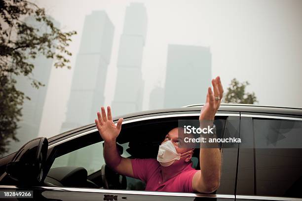 Mature Man Sitting In His Car And Praying For Rain Stock Photo - Download Image Now - Car, Pollution, Forest Fire