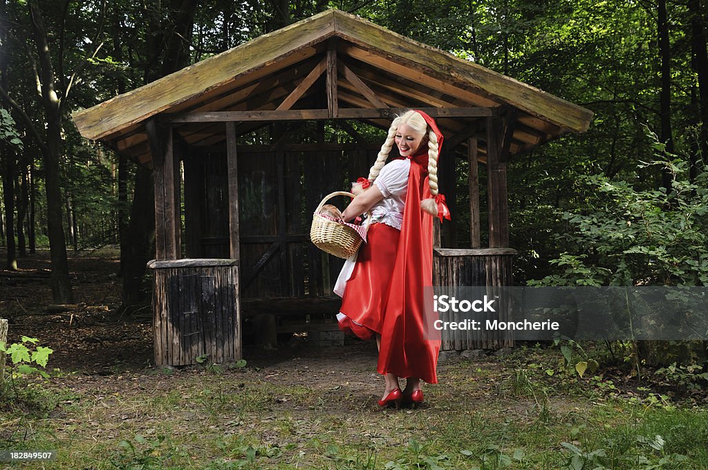 Cheerfull Little Red Riding Hood Checking Her Basket Adult Stock Photo