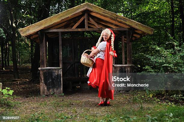 Cheerfull Little Red Riding Hood Checking Her Basket Stock Photo - Download Image Now