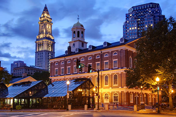 Faneuil Hall  in Boston Faneuil Hall is located near the waterfront and today's Government Center, in Boston, Massachusetts, has been a marketplace and a meeting hall since 1742.  Boston is known for its central role in American history,world-class educational institutions, cultural facilities, and champion sports franchises. market hall stock pictures, royalty-free photos & images