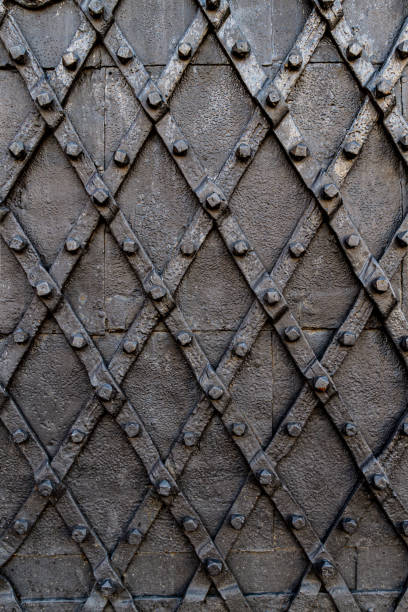 istock Old wrought iron door with spikes 1828514116