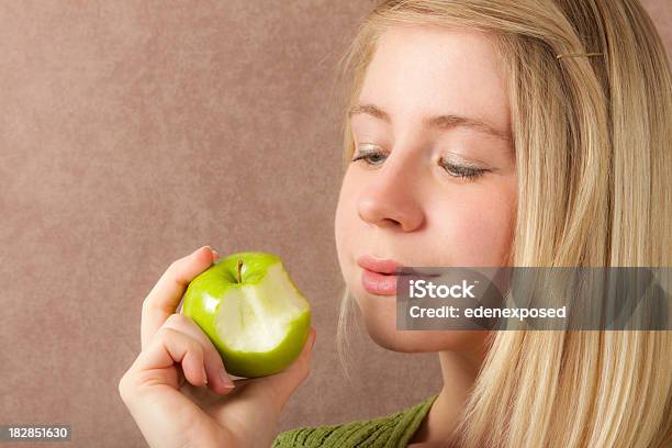 Woman Looking At Half Eaten Apple Stock Photo - Download Image Now - Adult, Adults Only, Apple - Fruit