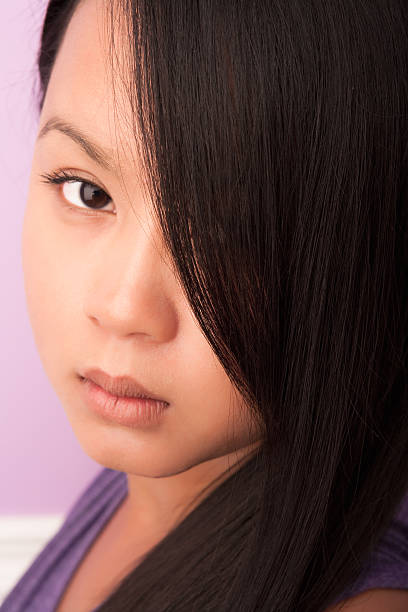 istock Beautiful young female asian headshot 182851689
