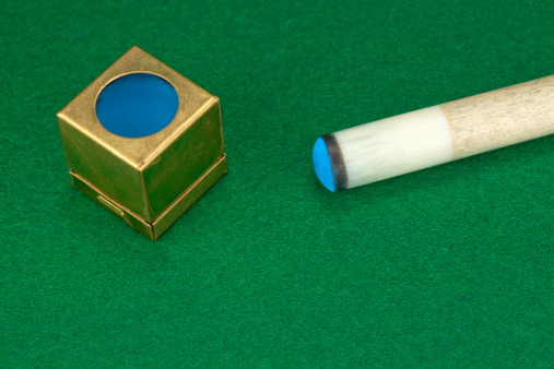 pool cue and chalk