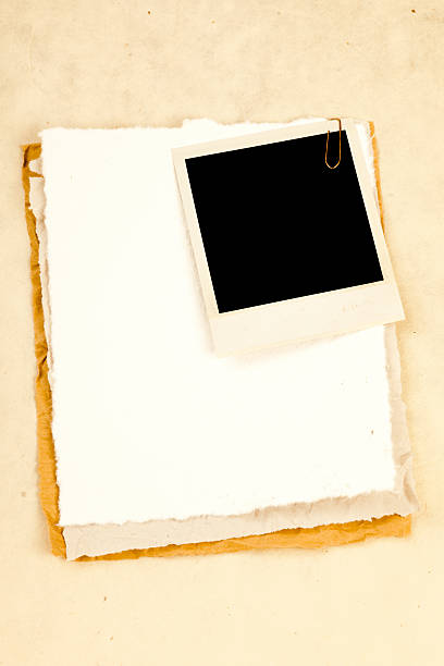 istock Pieces of old paper and a blank photo frame. 182852382