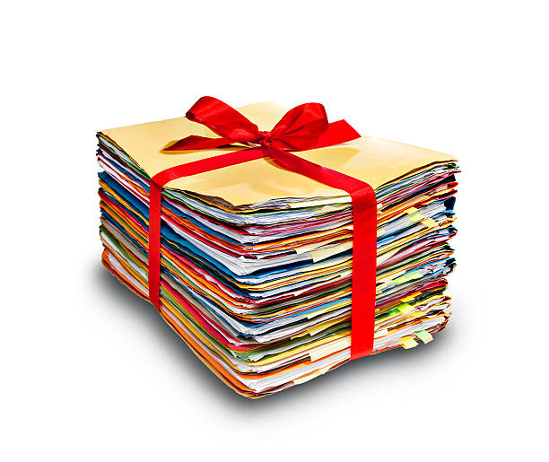 filestack enveloppé avec un nœud - stack of books photos et images de collection