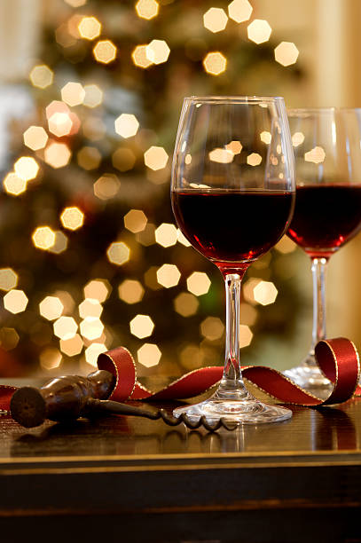 istock Glasses of wine at Christmas with a bokeh tree 182852883