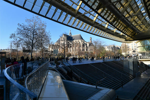 The Saint-Eustache church, Paris, France. Paris, France-12 02 2023: The Saint-Eustache church seen from the Forum des Halles shopping mall full of customers , Paris, France. église saint eustache stock pictures, royalty-free photos & images
