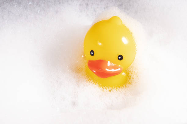 istock Floating rubber duck, bath relaxation, playful bath accessory, yellow ducky 1828536474