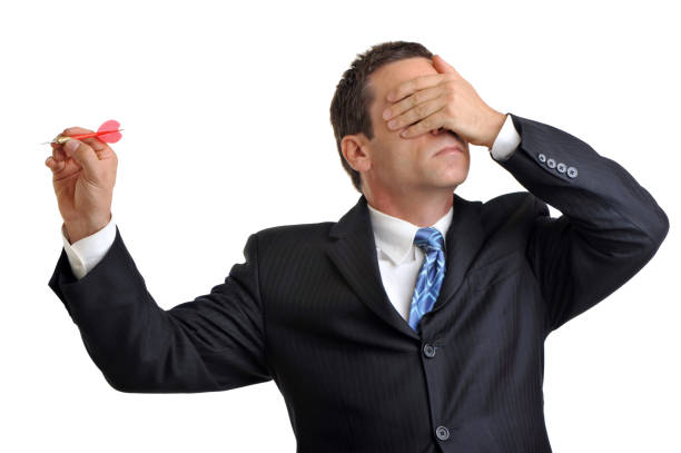 istock Businessman on white throwing dart with hand over eyes 182853712