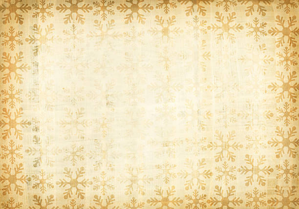 A grunge paper with patterns of snow flakes stock photo
